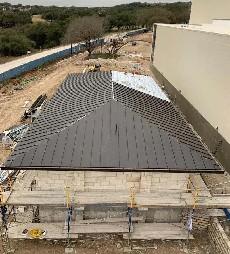 Metal roof new construction with scaffolding in Rowley